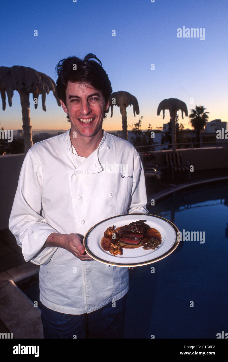 American chef Ken Frank shows off one of his dishes on outdoor terrace