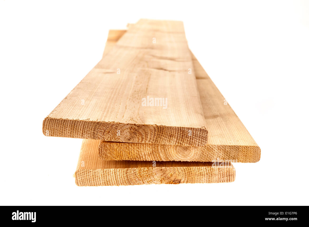 Three cedar one by six inch wood planks on white background Stock Photo