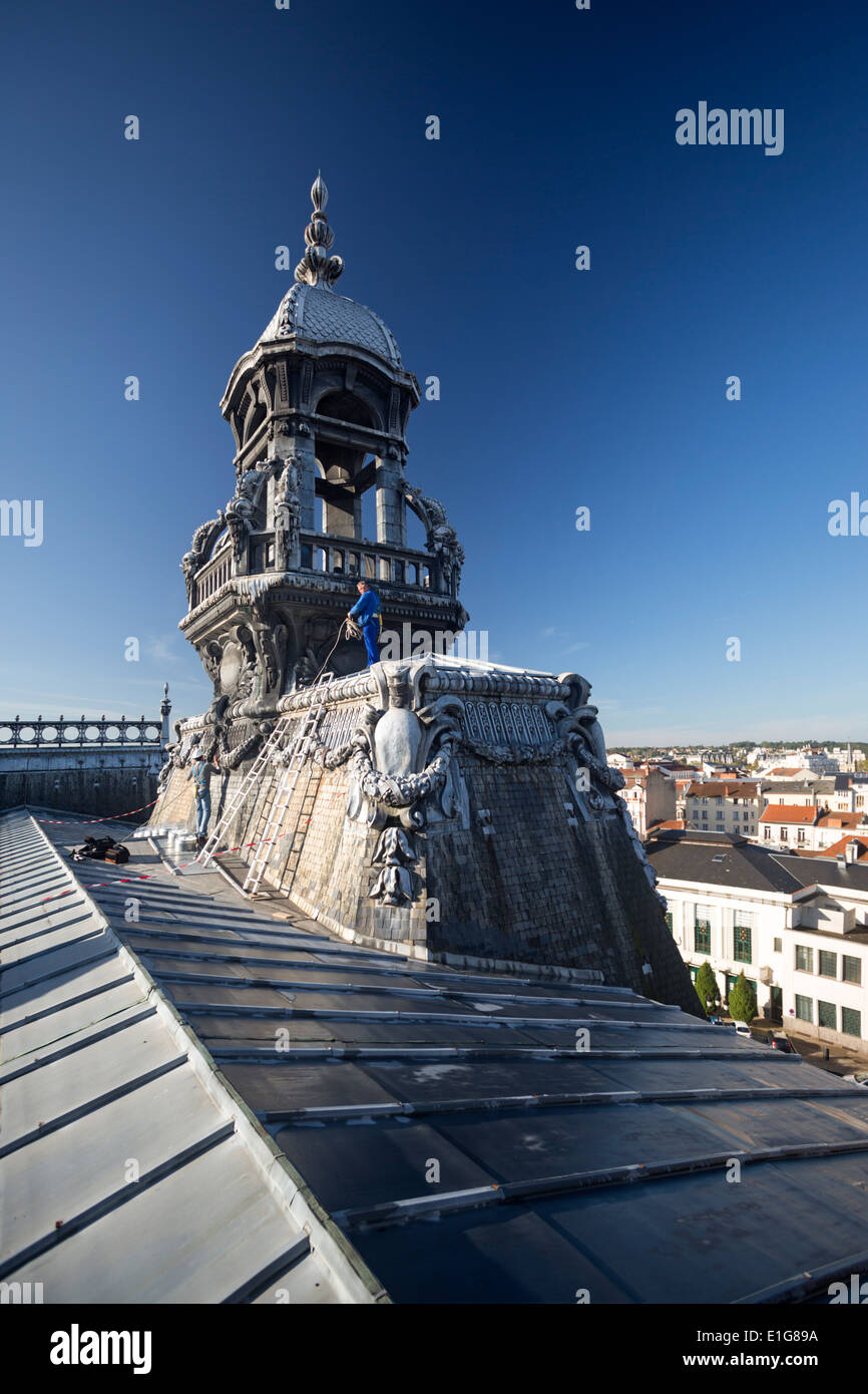 The metal roofing with stylized dolphins on top of the zinc and tin roof of the Vichy town hall (Allier - Auvergne - France). Stock Photo