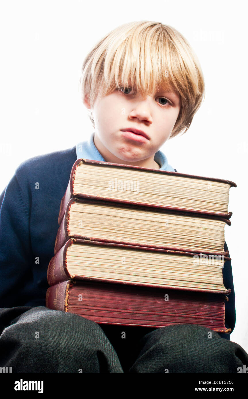 unhappy school boy with his school books Stock Photo - Alamy