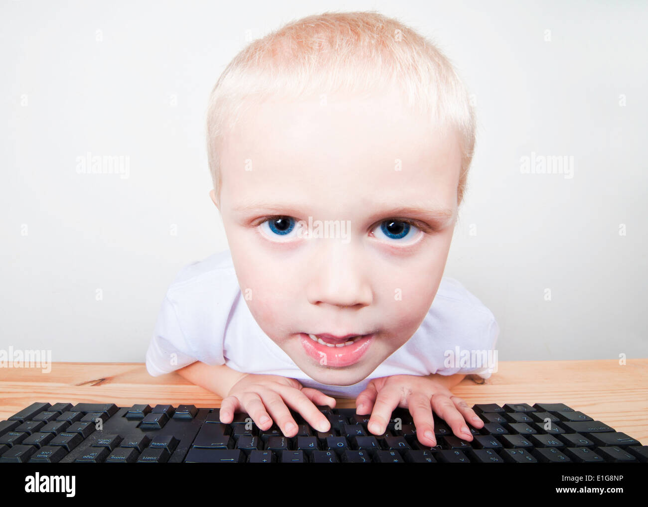 Small boy looking at computer screen Stock Photo