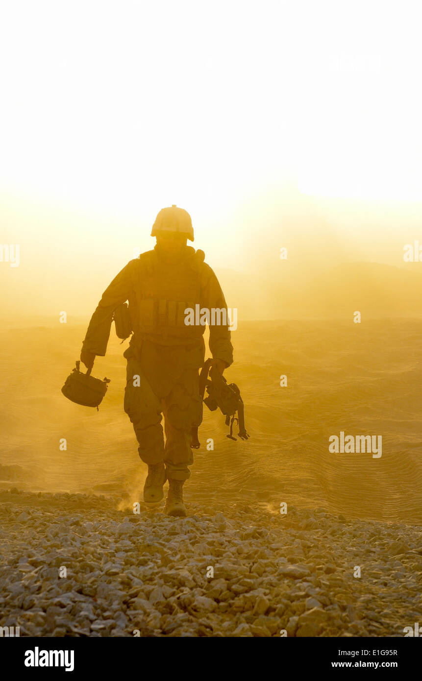 U.S. Navy Construction Mechanic 3rd Class Ty Ramsey finishes a day of ...