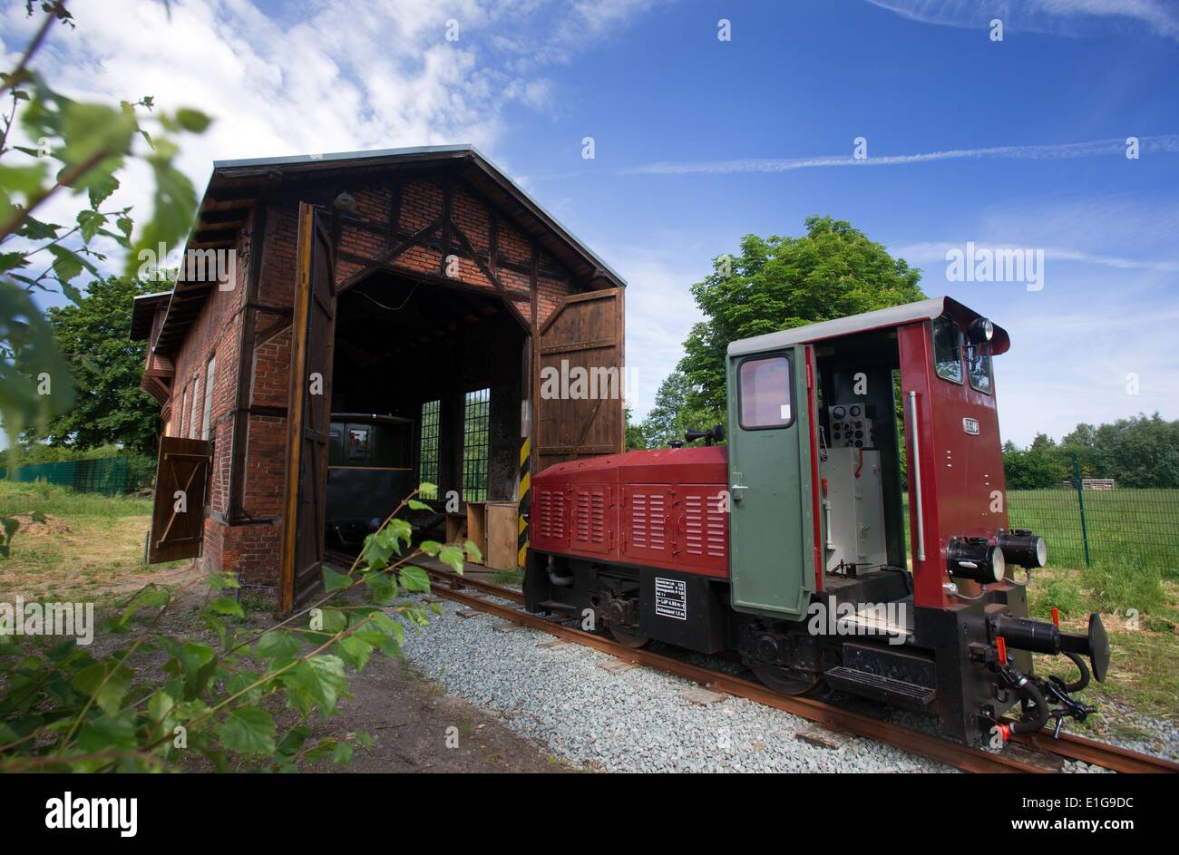The narrow gage diesel locomotive DIEMA DFL 75 at an historic depot on the new railway route of the historic 'Kaffeebrenner' (coffee burner) in Kluetz, Germany, 03 June 2014. The route was closed ten years ago but will open again as a narrow gage line on 21 June with an investment of around 2 million euros into the line which originally opened in 1905. The name Kaffeebrenner comes from the use of the line to transport grain and oats for malt coffee production. The operator of the six kilometer long touristic route is the German Narrow Gage Railway Foundation. Photo: JENS BUETTNER/dpa Stock Photo