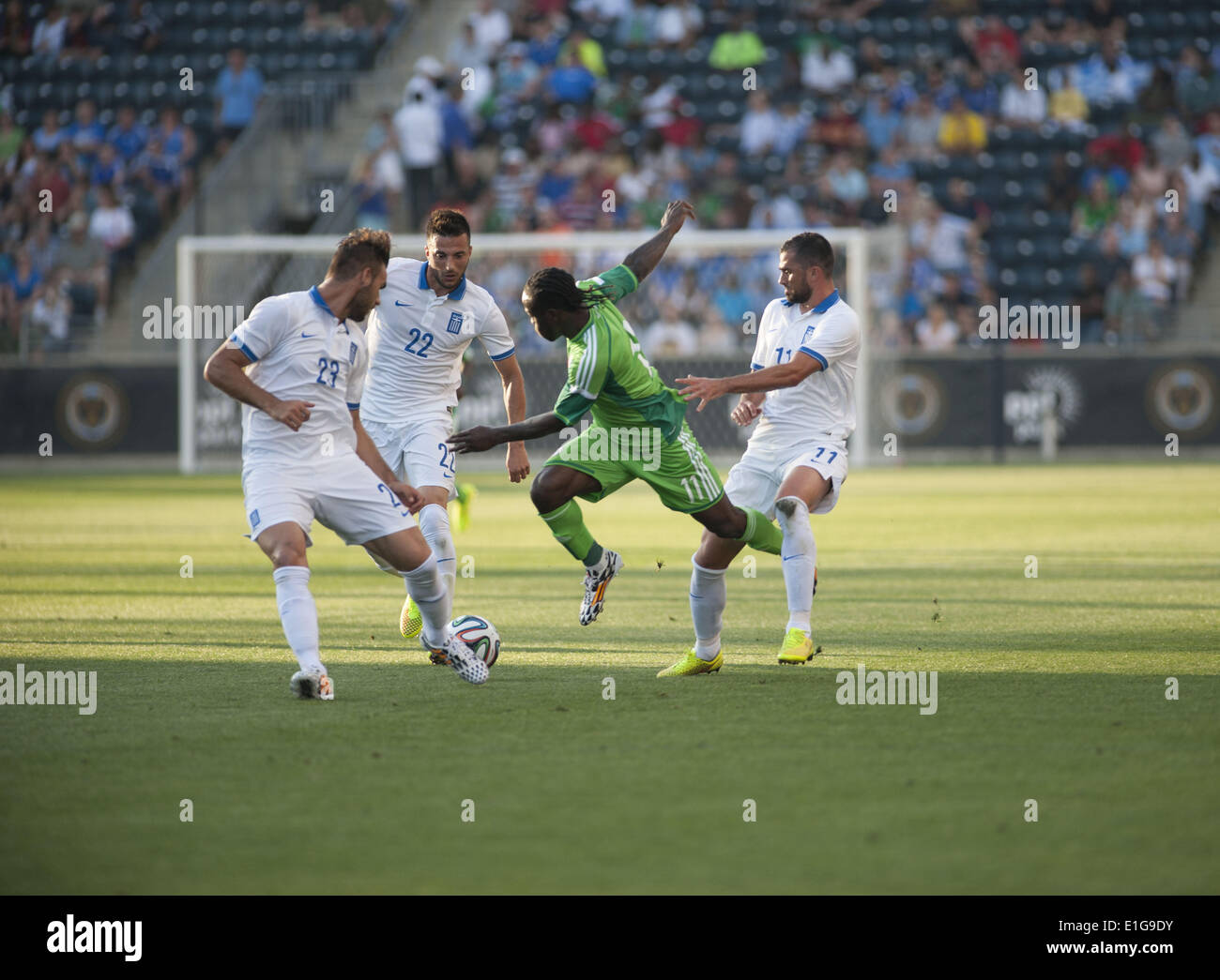 Chester, Pennsylvania, USA. 3rd June, 2014. VICTOR MOSES( 11) of Nigeria pushes the ball towards goal against ANDREA SAMARIS (22) and PANAGIOTIS TACHTSIDIS (23) of Greece. The international friendly match was held at PPL Park in Chester Pa © Ricky Fitchett/ZUMAPRESS.com/Alamy Live News Stock Photo