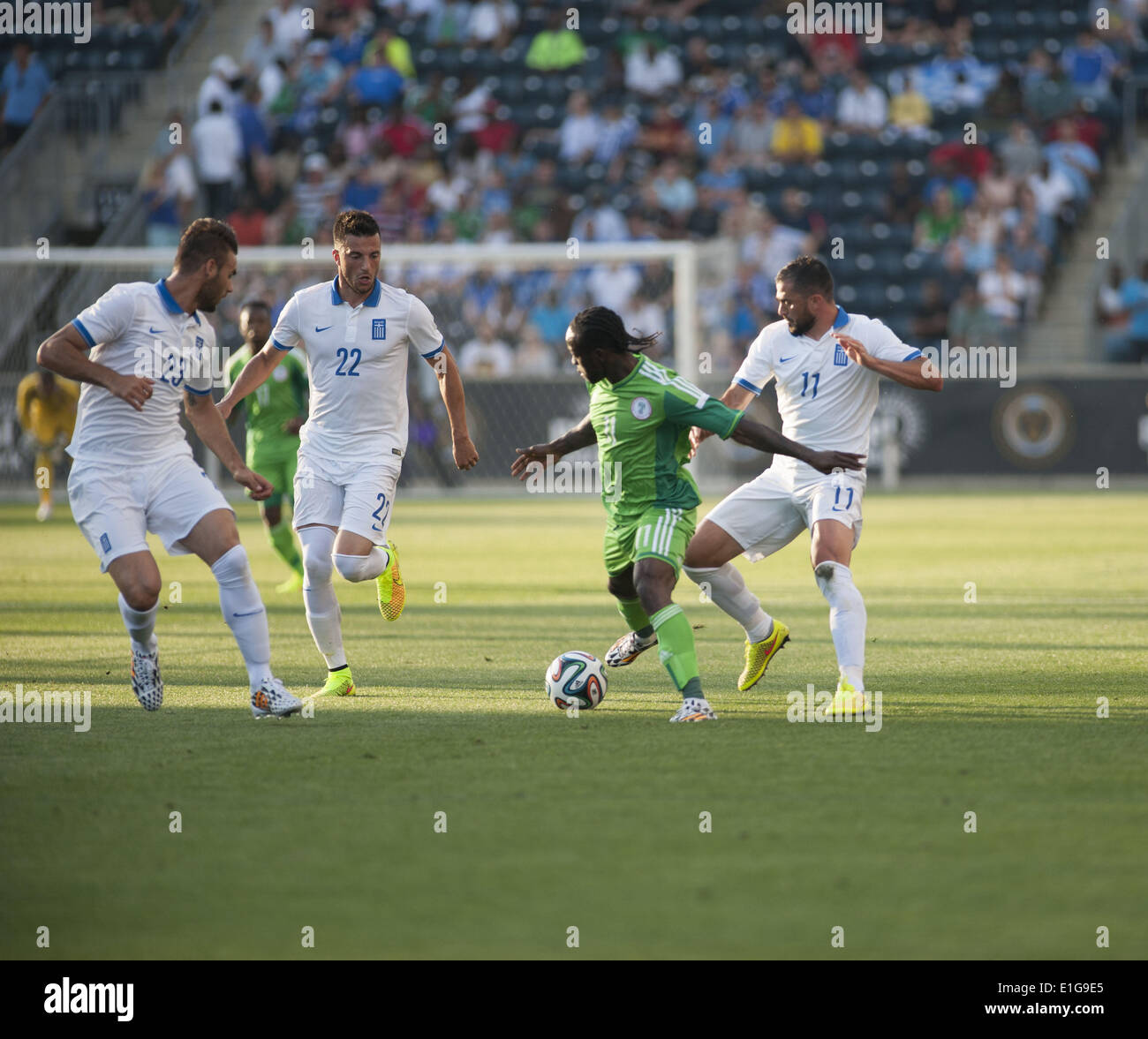 Chester, Pennsylvania, USA. 3rd June, 2014. VICTOR MOSES( 11) of Nigeria pushes the ball towards goal against ANDREA SAMARIS (22) and PANAGIOTIS TACHTSIDIS (23) of Greece. The international friendly match was held at PPL Park in Chester Pa © Ricky Fitchett/ZUMAPRESS.com/Alamy Live News Stock Photo