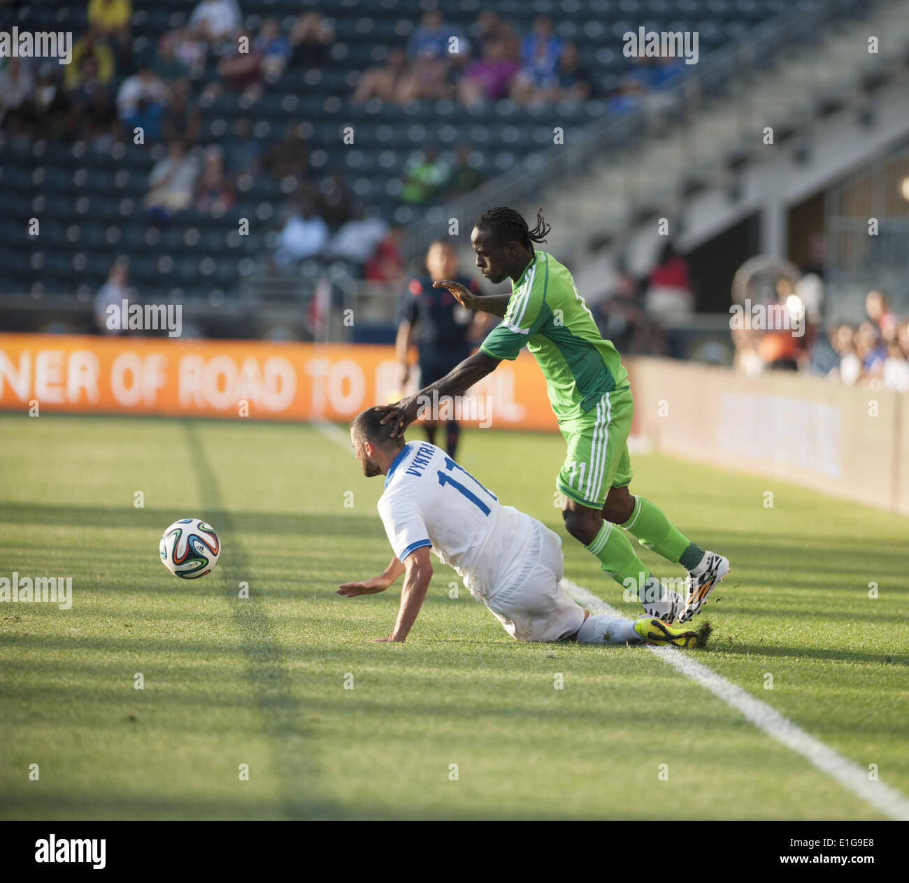 Chester, Pennsylvania, USA. 3rd June, 2014. VICTOR MOSES (11) of Nigeria in action against LOUKAS VYNTRA (11) of Greece at PPL Park in Chester Pa © Ricky Fitchett/ZUMAPRESS.com/Alamy Live News Stock Photo