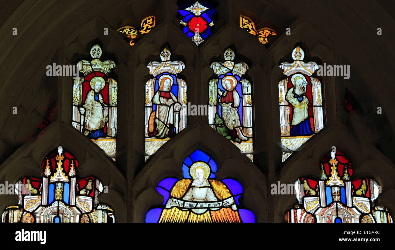 Medieval stained glass window Wighton, Norfolk, 15th century, 4 female saints and angel, including St. Catherine and St.Agatha Stock Photo