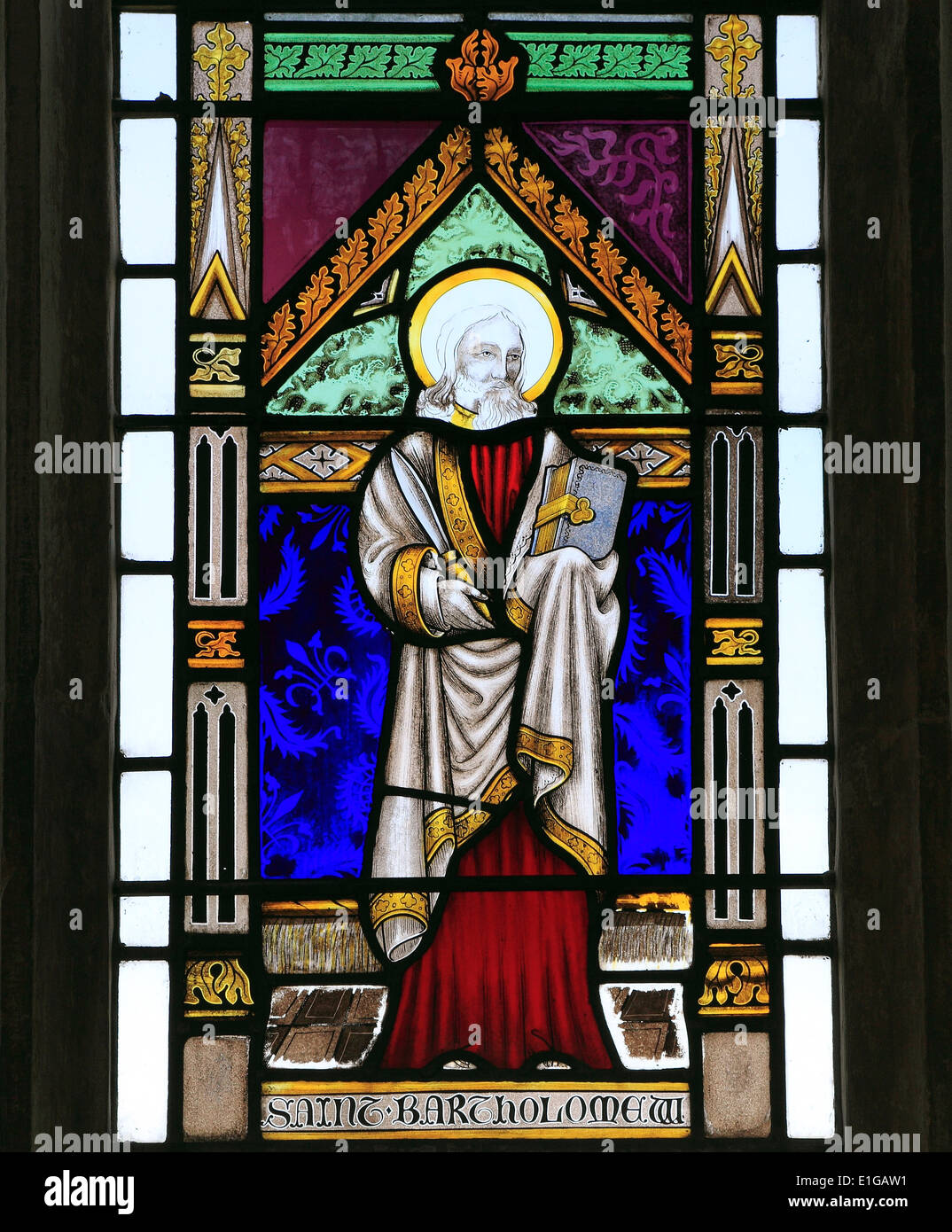 St. Bartholomew, stained glass window by Joseph Grant of Costessey, 1856, Wighton, Norfolk England UK saint saints English Stock Photo