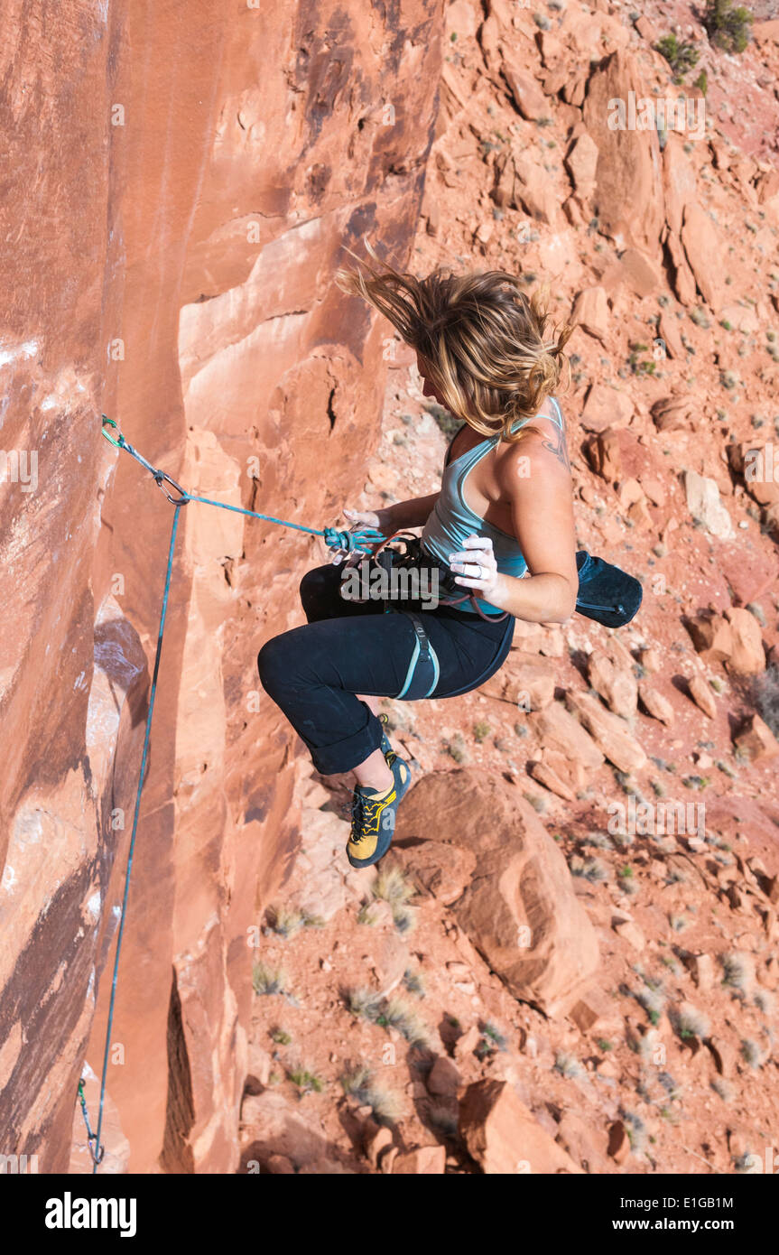 A woman falling while rock climbing in Long Canyon, Moab, Utah Stock Photo  - Alamy