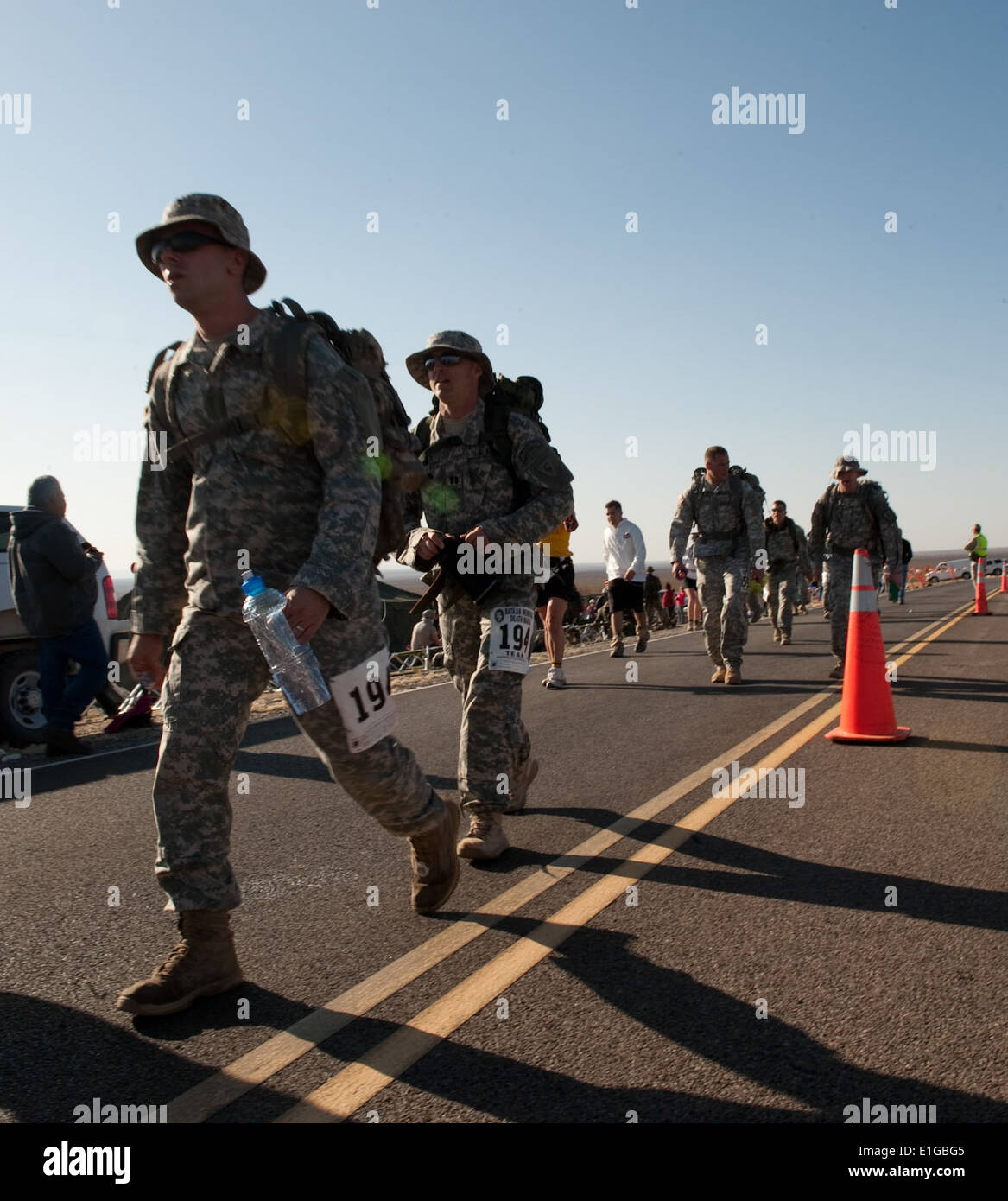 U.S. Army Sgt. Joshua Chenault, Capt. Andrew Miller, Sgt. Tyson Waldron and Maj. Gary Blagburn walk past the eight-mile point o Stock Photo