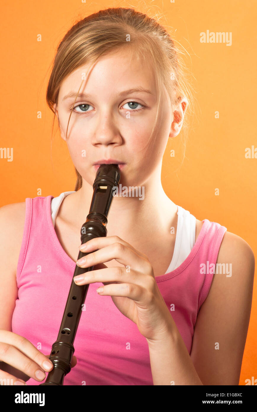 Girl playing an instrument Stock Photo