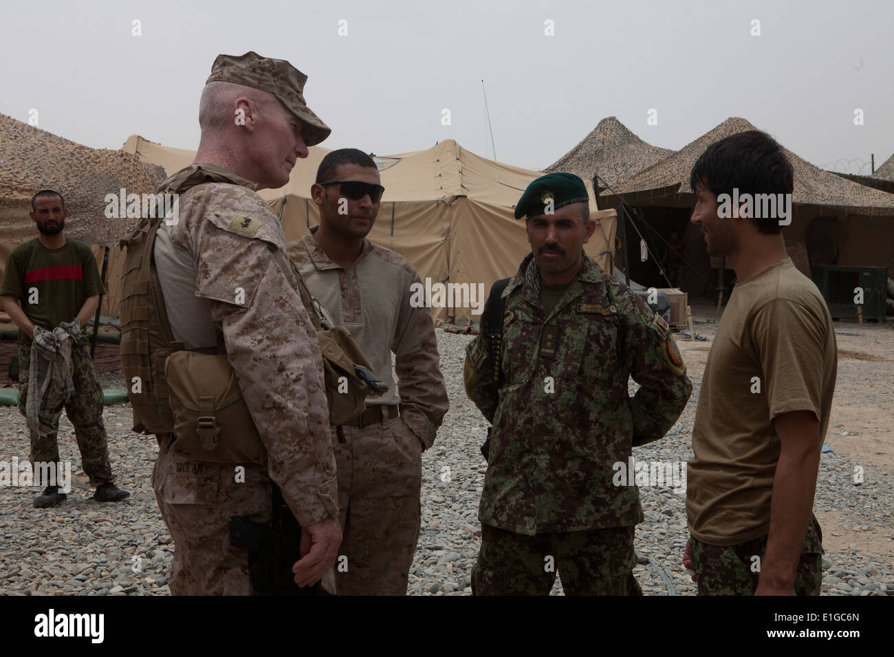 U.S. Marine Corps Maj. Gen. John A. Toolan, commander, Regional Command (Southwest), visits an Afghan National Army post at Com Stock Photo