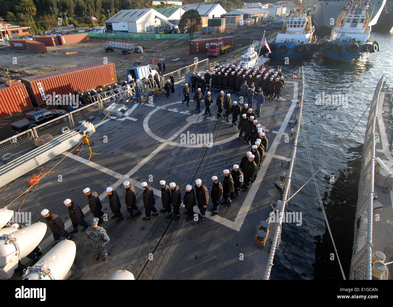Chilean navy recruits board the guided missile frigate USS Boone (FFG 28) for a tour of the ship during Southern Seas 2011 in T Stock Photo