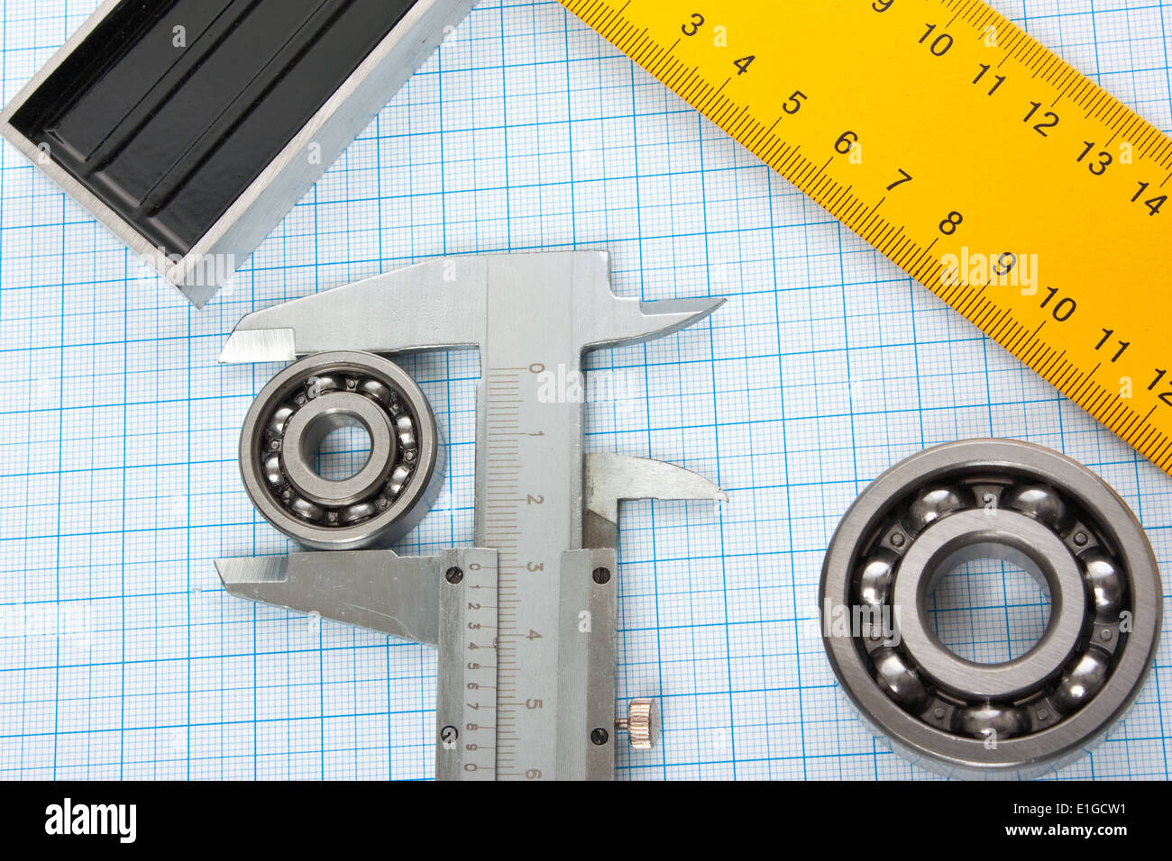 setsquare and calliper with bearing on graph paper Stock Photo Alamy