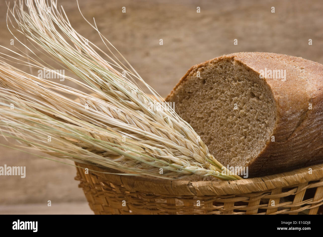 rye bread and ears of corn in the basket Stock Photo