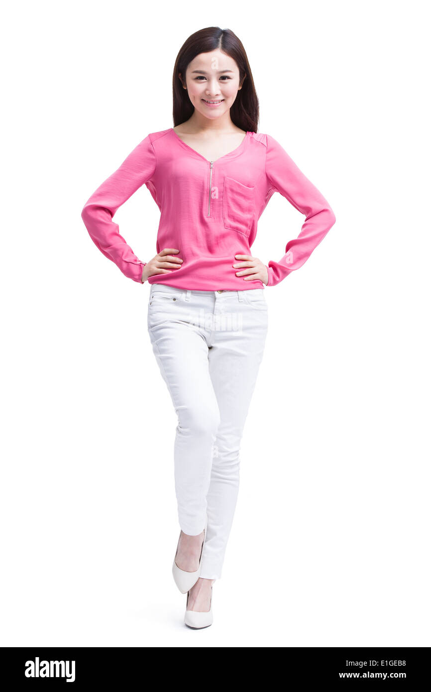 Portrait of young woman hand on hip Stock Photo - Alamy