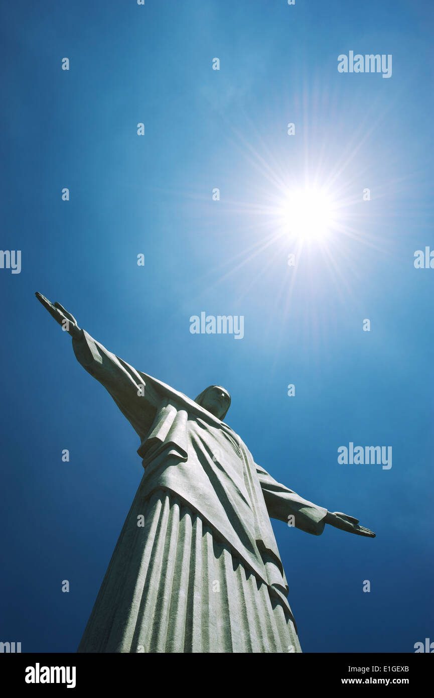 RIO DE JANEIRO, BRAZIL - OCTOBER 20, 2013: Close-up of the statue of Christ the Redeemer at Corcovado Mountain blue sky sun. Stock Photo