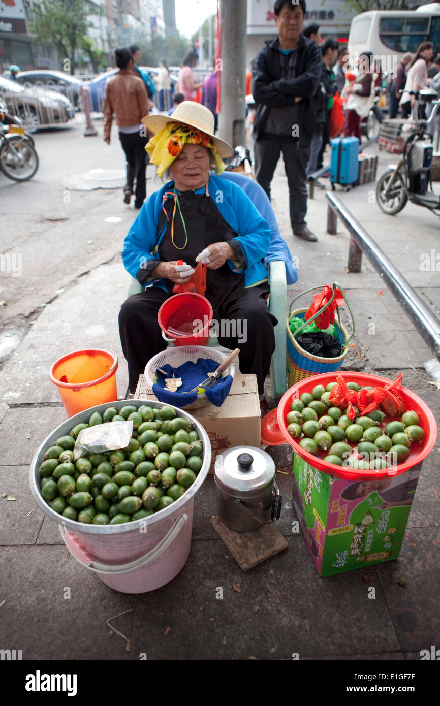 A woman selling a betel nuts on the street in Sanya, Hainan, China, on 07 January 2014. Betel nuts are mild stimulant. Stock Photo
