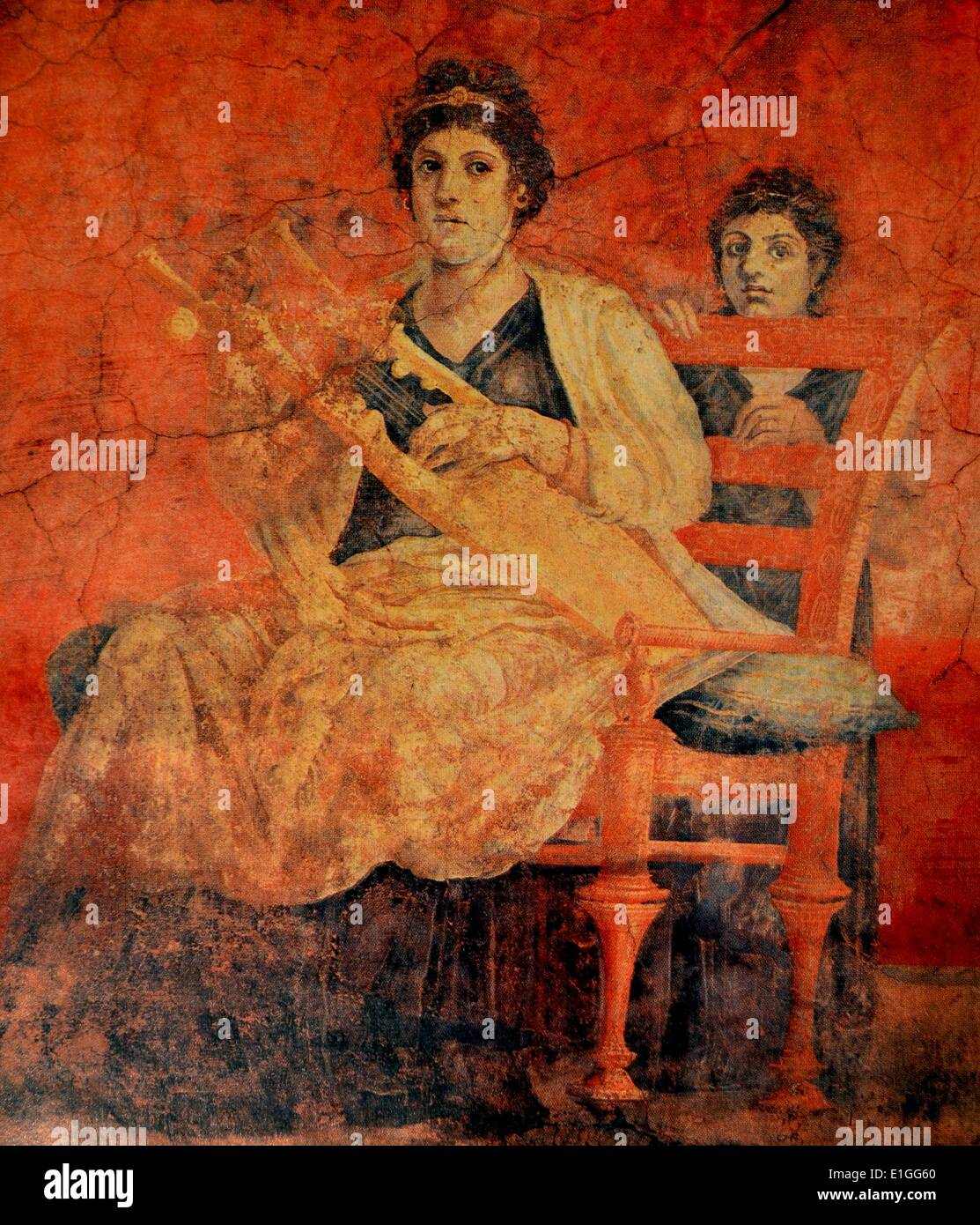 A Roman fresco, discovered in Pompeii, depicits a woman seated on a bronze chair, with a back, playing a Greek musical instrument called a Kithara. Chairs with a back for the Romans was a symbol of dignity or respect, reserved for high officials or woman of rank (the ceremonial use of thrones a vestige of this tradition) such as the woman in this fresco. Dated 50 B.C. Stock Photo