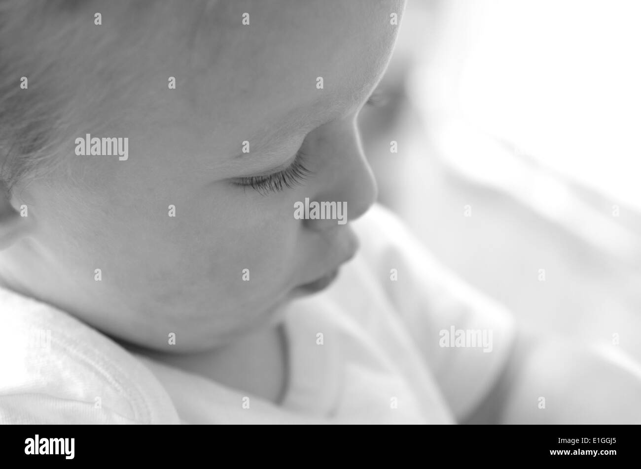 thoughtful toddler deep in concentration Stock Photo