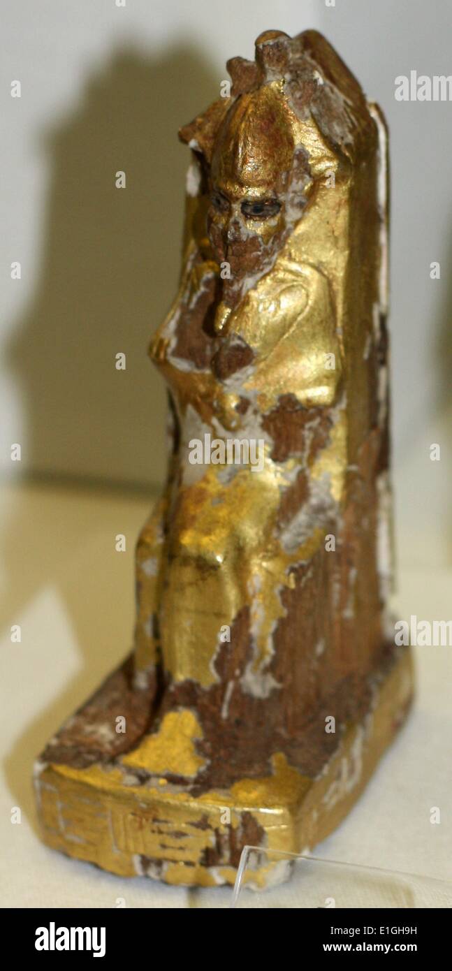 Seated figure of Osiris.  Gold leaf over wood.  Ptolemaic 300-100 B.C. Stock Photo