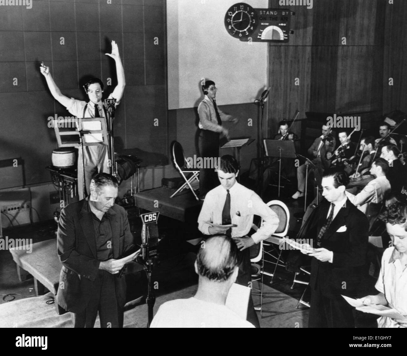 Orson Welles rehearsing a radio broadcast of H.G. Wells' classic, The War of the Worlds on October 10, 1938. The broadcast, which claimed that aliens from Mars had invaded New Jersey, terrified thousands of Americans. Stock Photo