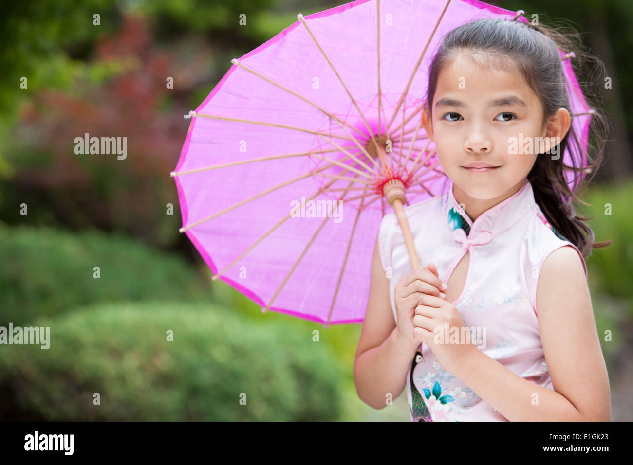 Little girl in Chinese traditional clothing cheongsam Stock Photo