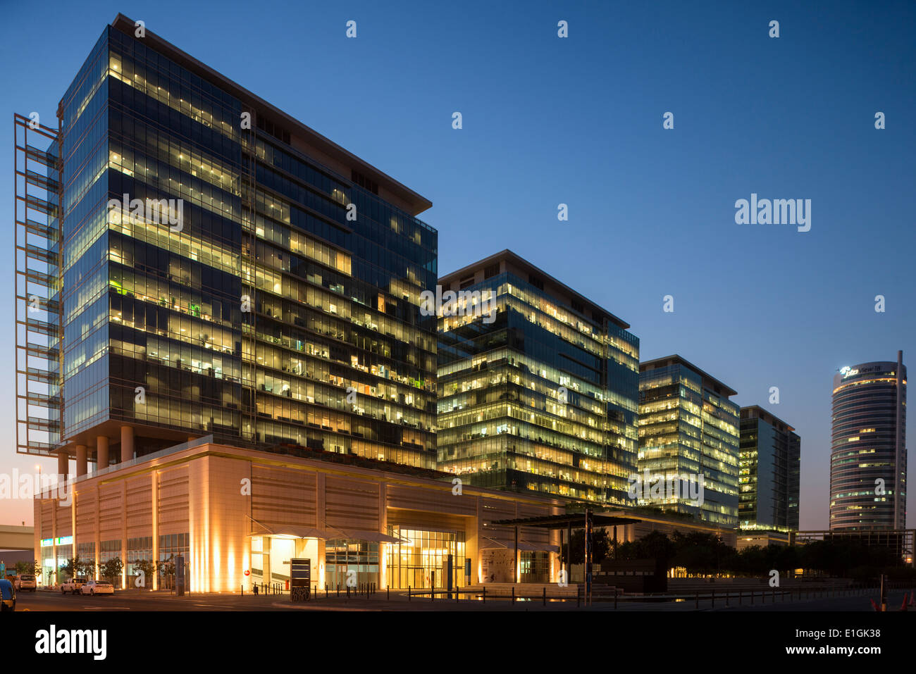 View of modern office buildings at night at Jebel Ali Downtown