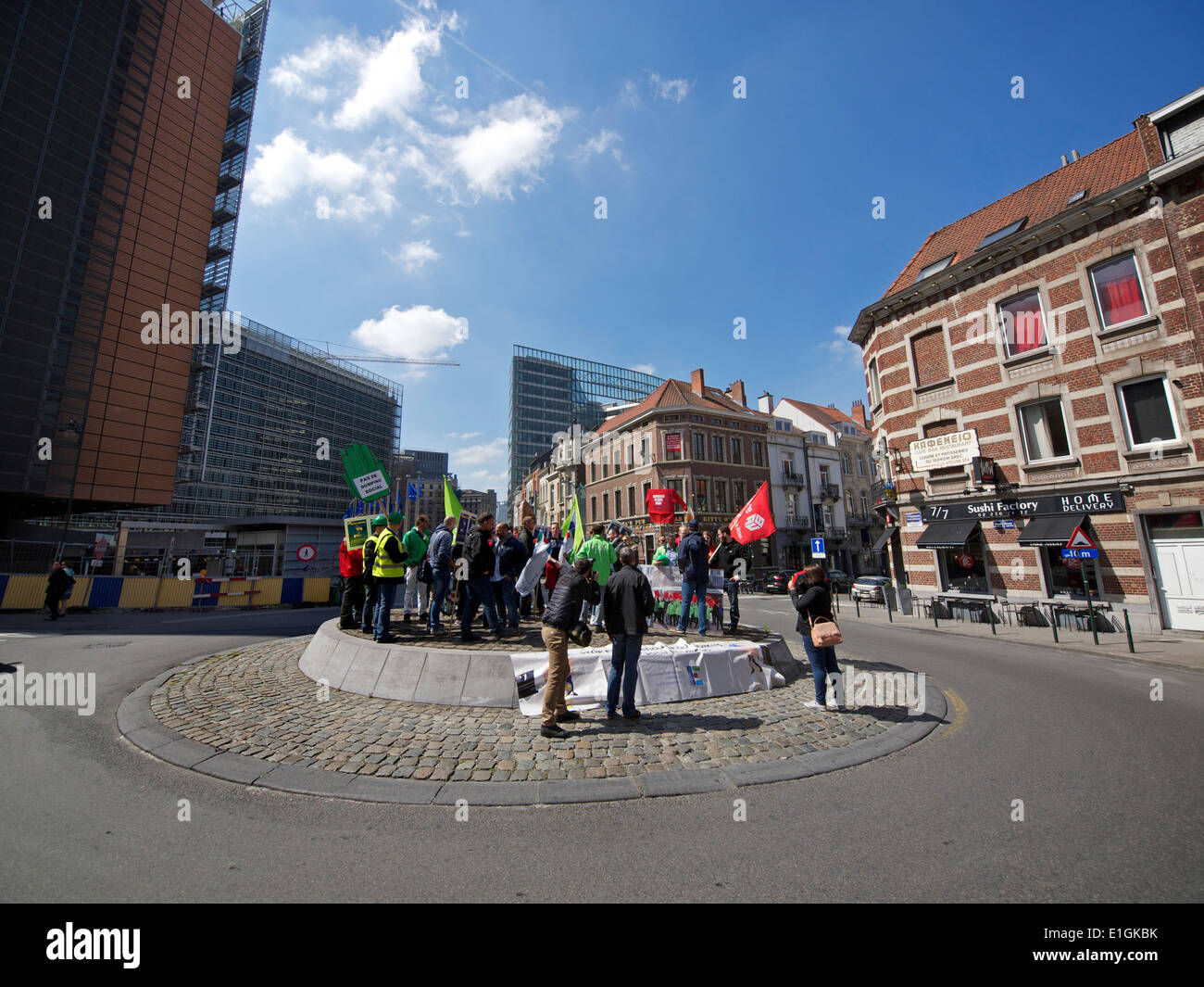 Small group of protesters on a roundabout at the European Commission building in Brussels, Belgium Stock Photo