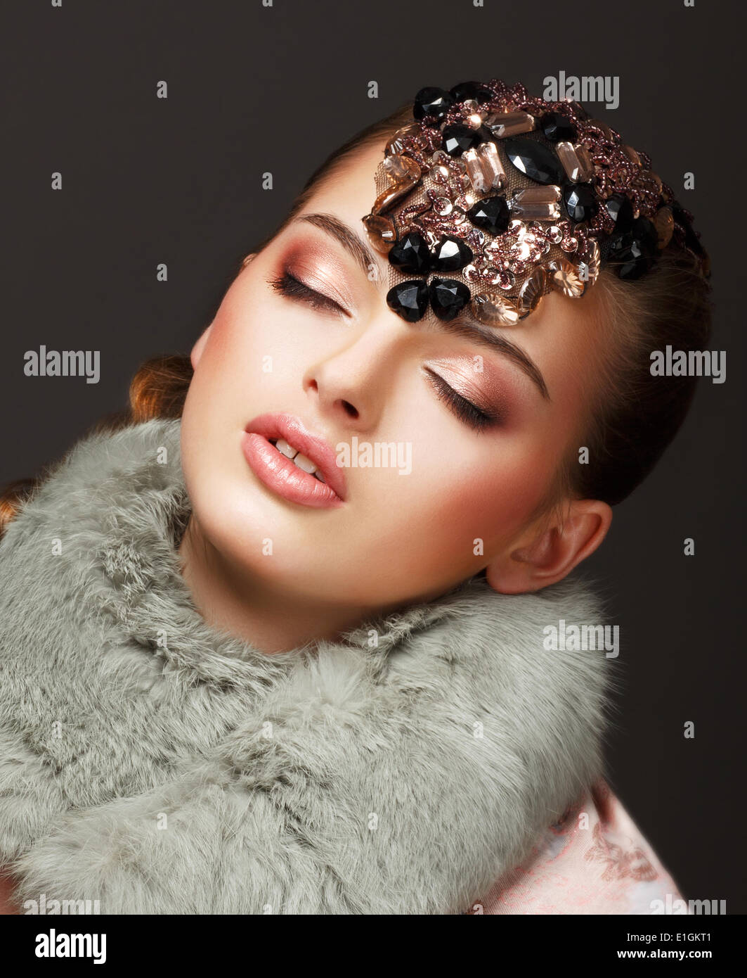 Passion. Glamorous Dreamy Woman in Fur Mantle and Jewels. Luxury Stock Photo