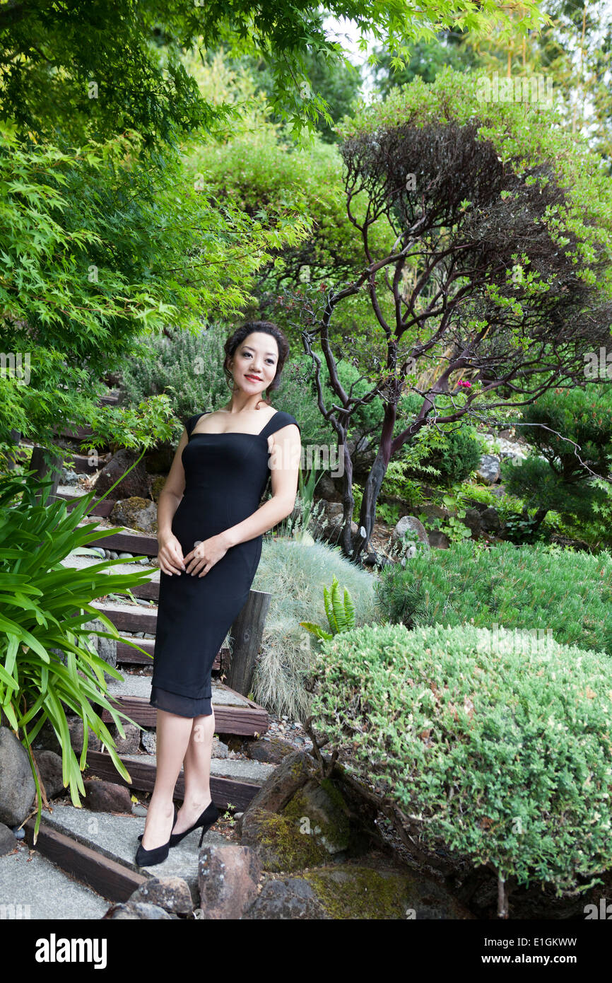 Mature woman in black dress hi-res stock photography and images - Alamy