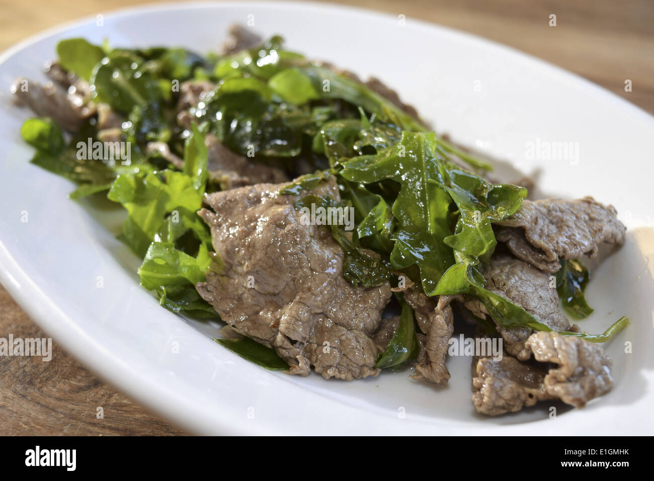traditinal Italian second dish: beef strips with rocket Stock Photo