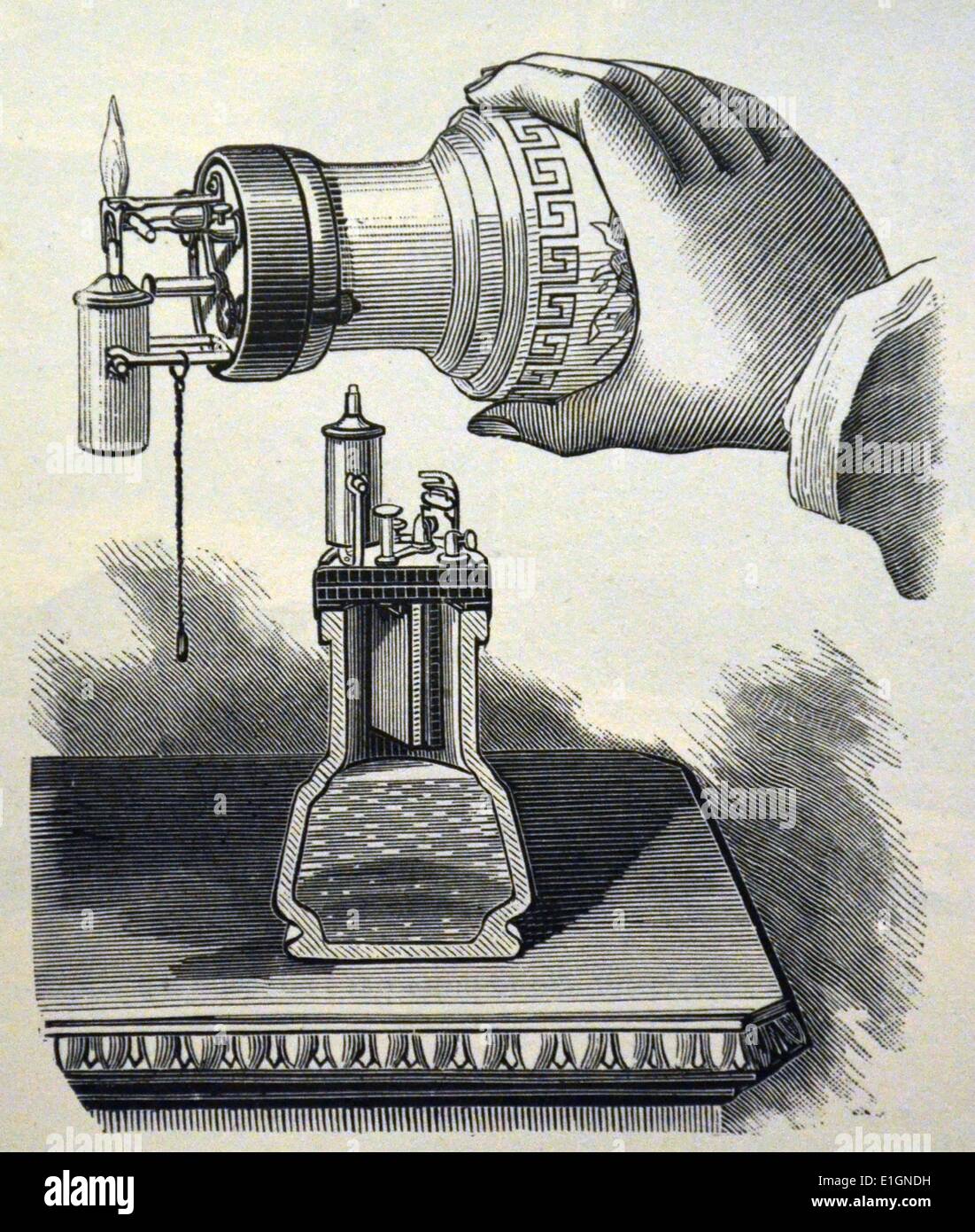 Table lighter which used an electrically produced spark to ignite alcohol.  Wood engraving from ''Tout par l'Electricite' by Georges Dary, Paris, 1881., Stock Photo