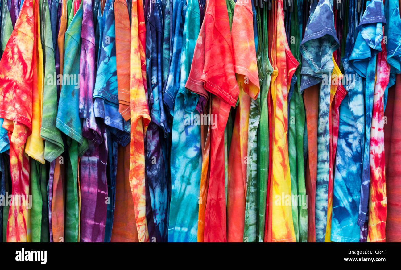 Tie Dyed t shirts on a rack at a VW Show. England Stock Photo