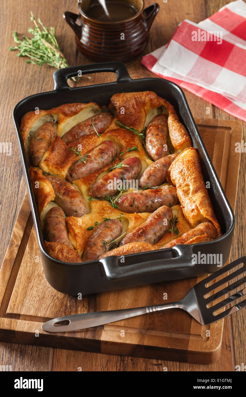 Toad in the hole. Sausages cooked in batter. UK Food Stock Photo