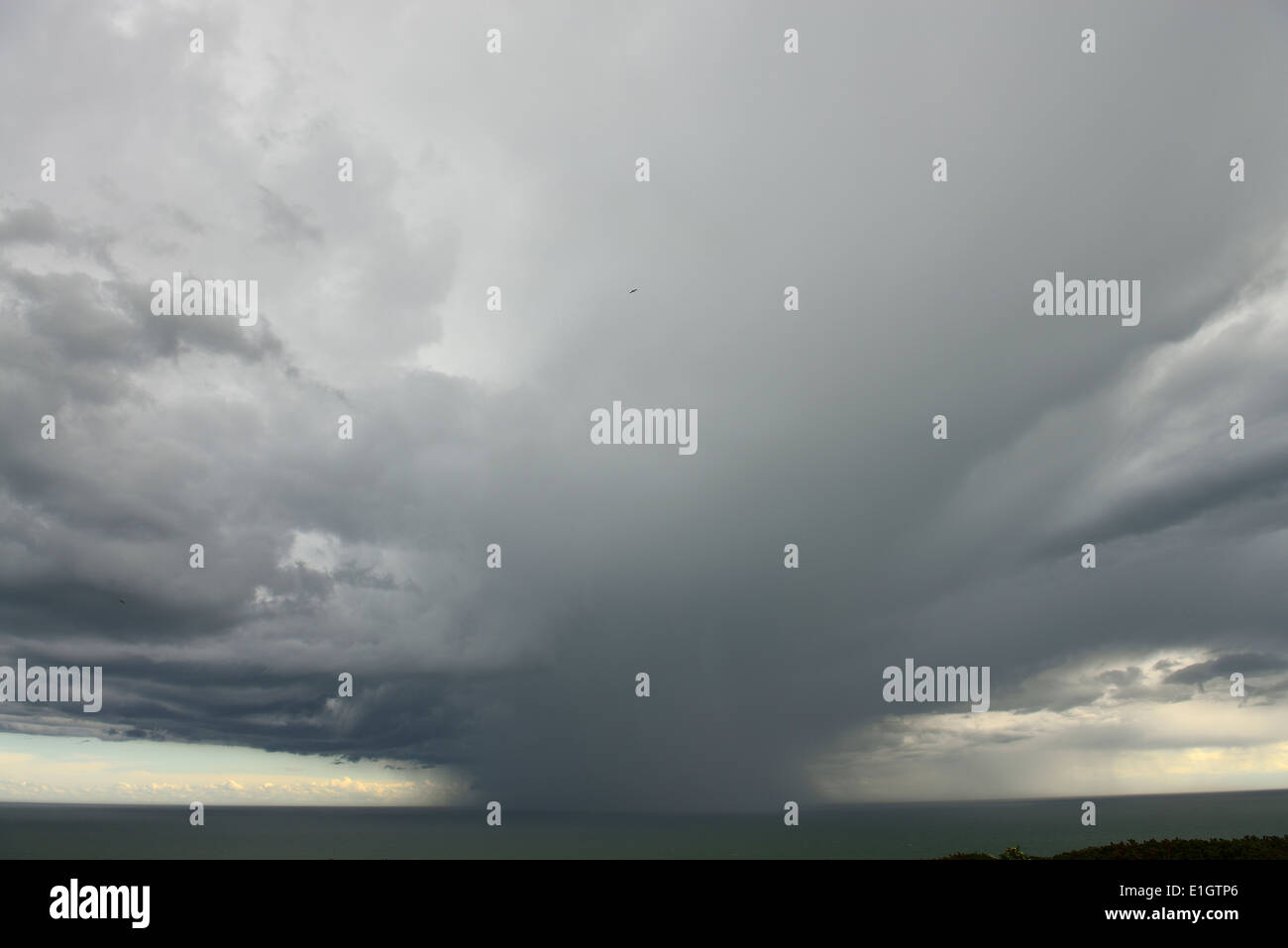 Storm, heavy rain shower, thunderstorm out at sea. Hastings. East