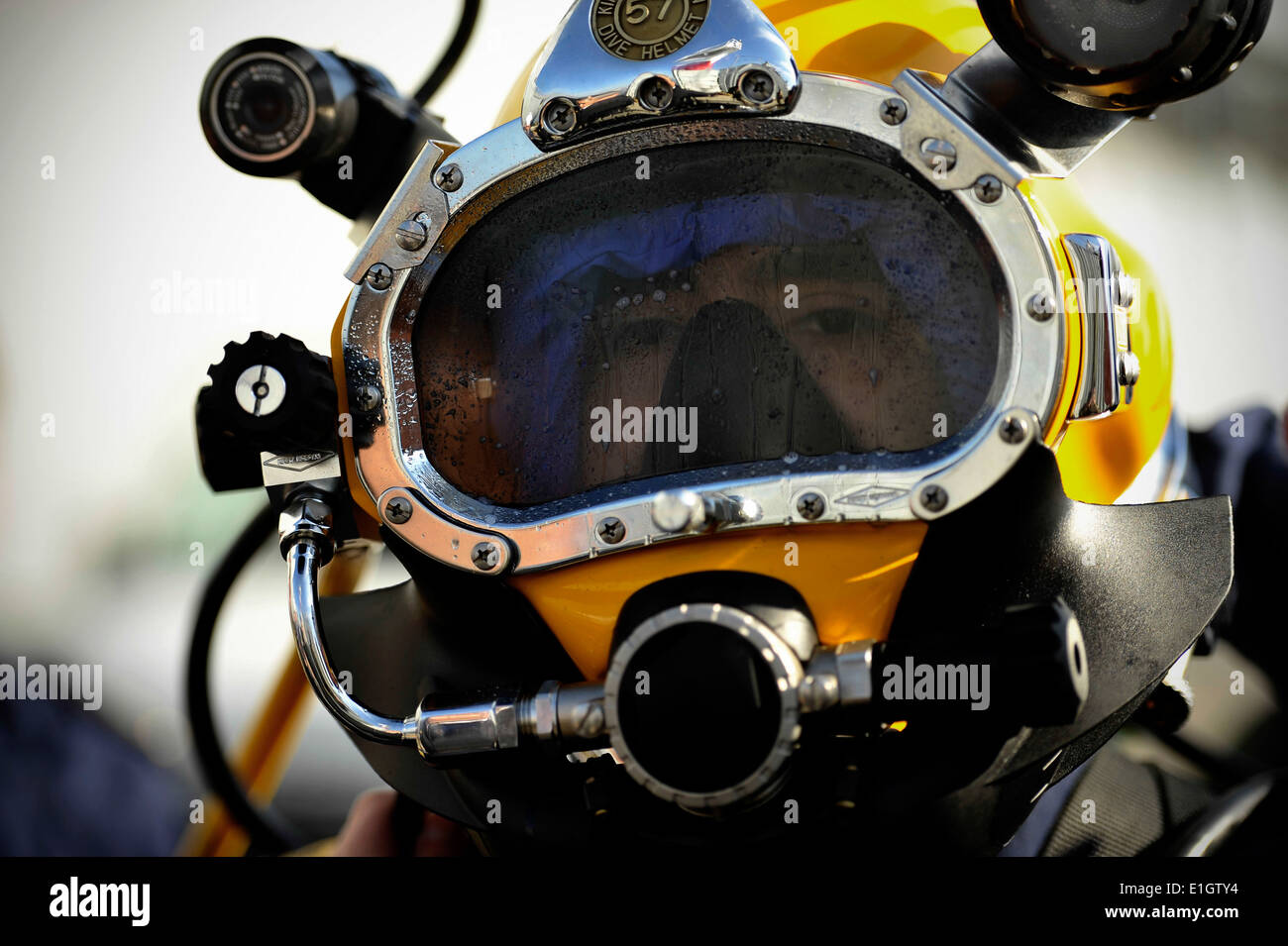 Chilean sailor John Ramon demonstrates Chilean navy dive gear to members of U.S. Navy Mobile Diving and Salvage Unit (MDSU) 2 i Stock Photo