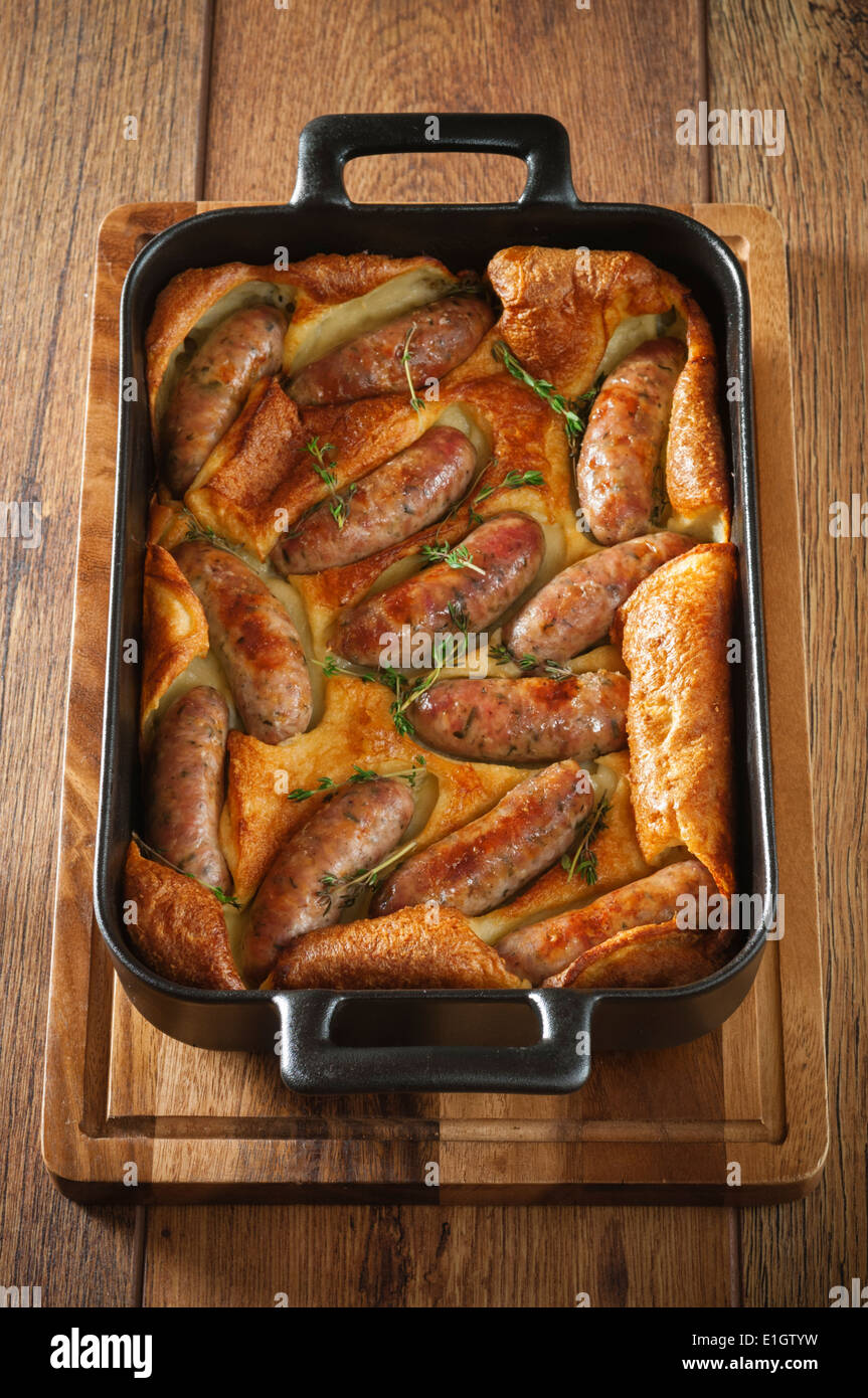 Toad in the hole. Sausages cooked in batter. UK Food Stock Photo