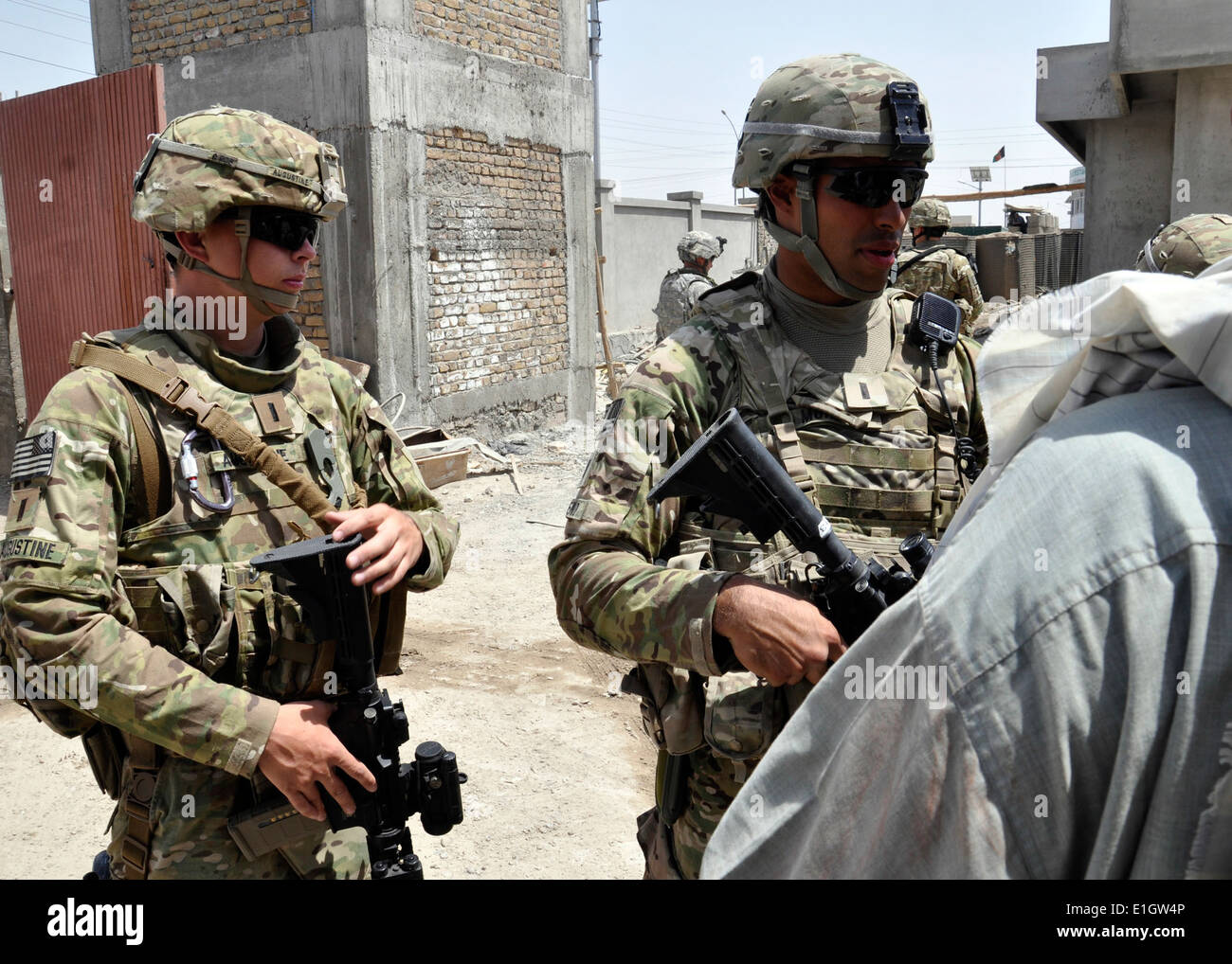 U.S. Army 1st Lt. Alec Augustine-Marceil, left, a civil affairs Stock ...