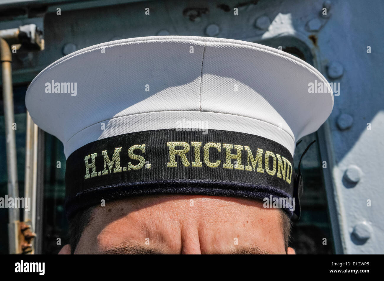Royal Navy sailor wears a cap with 'HMS Richmond' Stock Photo