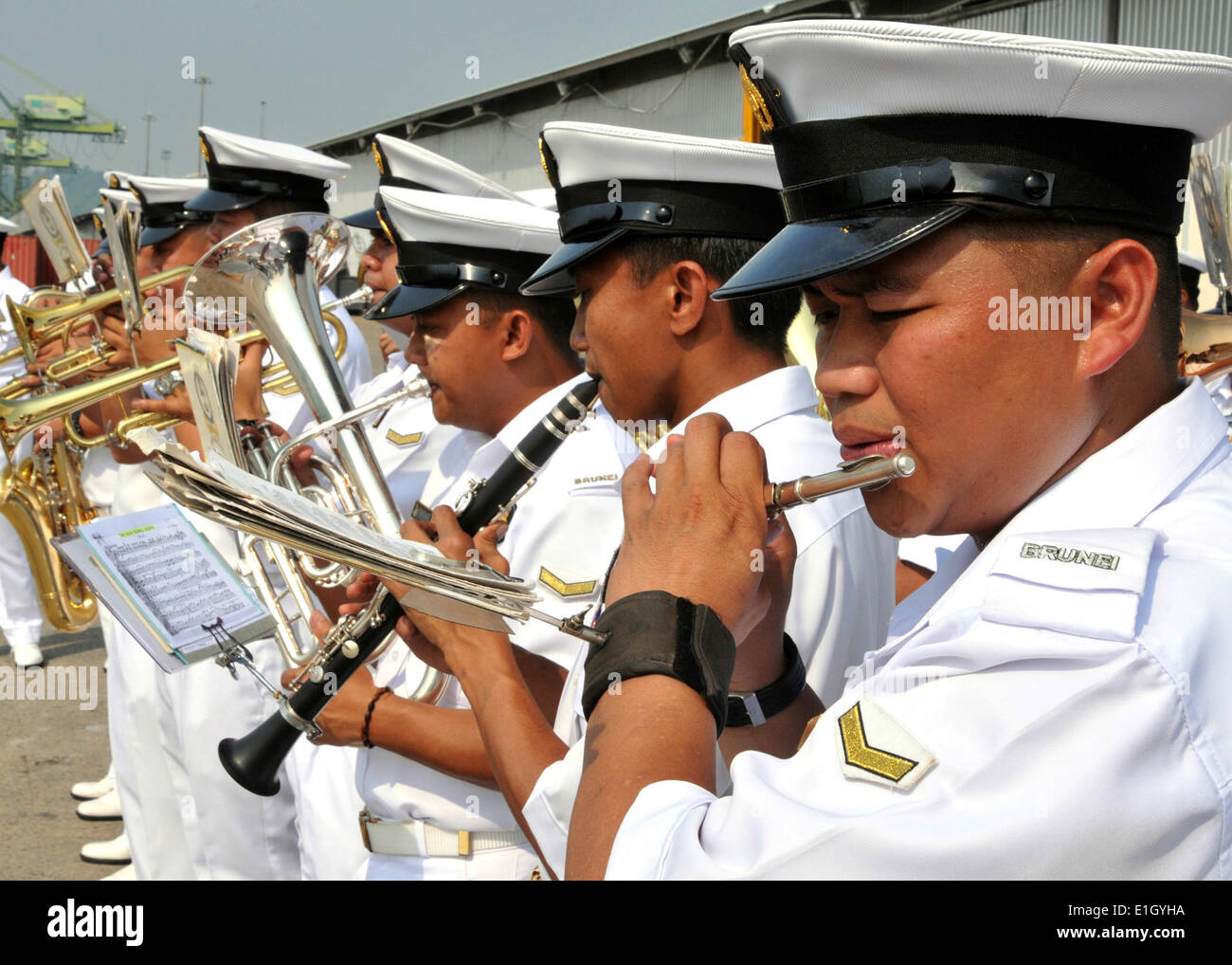 The Royal Brunei Navy band performs during the arrival of the guided missile destroyers USS Dewey (DDG-105) and USS Pinckney (D Stock Photo