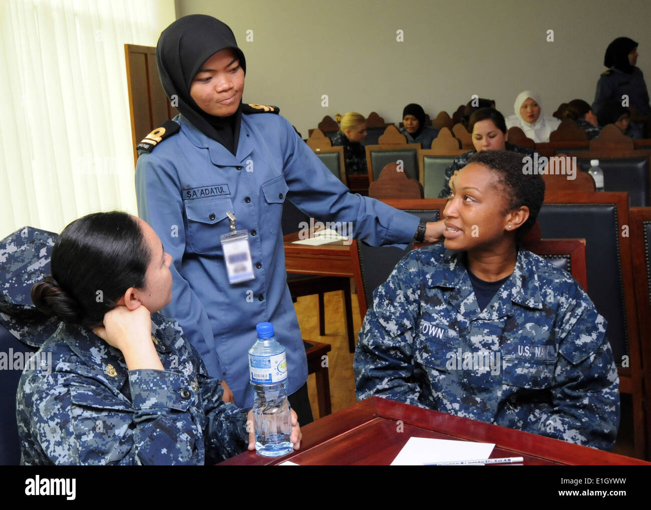 U.S. Navy Chief Fire Controlman Sandra Valdez, left, and Fire Controlman Tanysha Brown, both assigned to the guided missile des Stock Photo