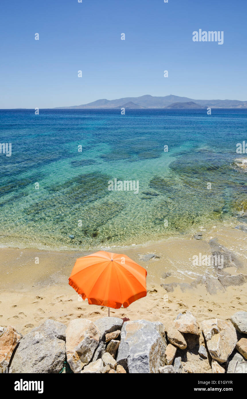 Orange beach umbrella on a beach in Greece Stock Photo Alamy