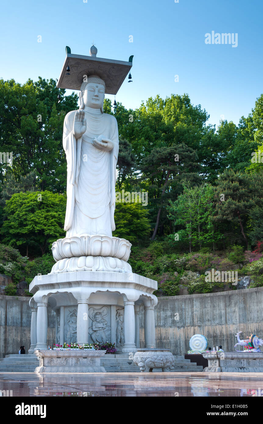A giant Buddha statue overlooks downtown Seoul from Bongeunsa Temple