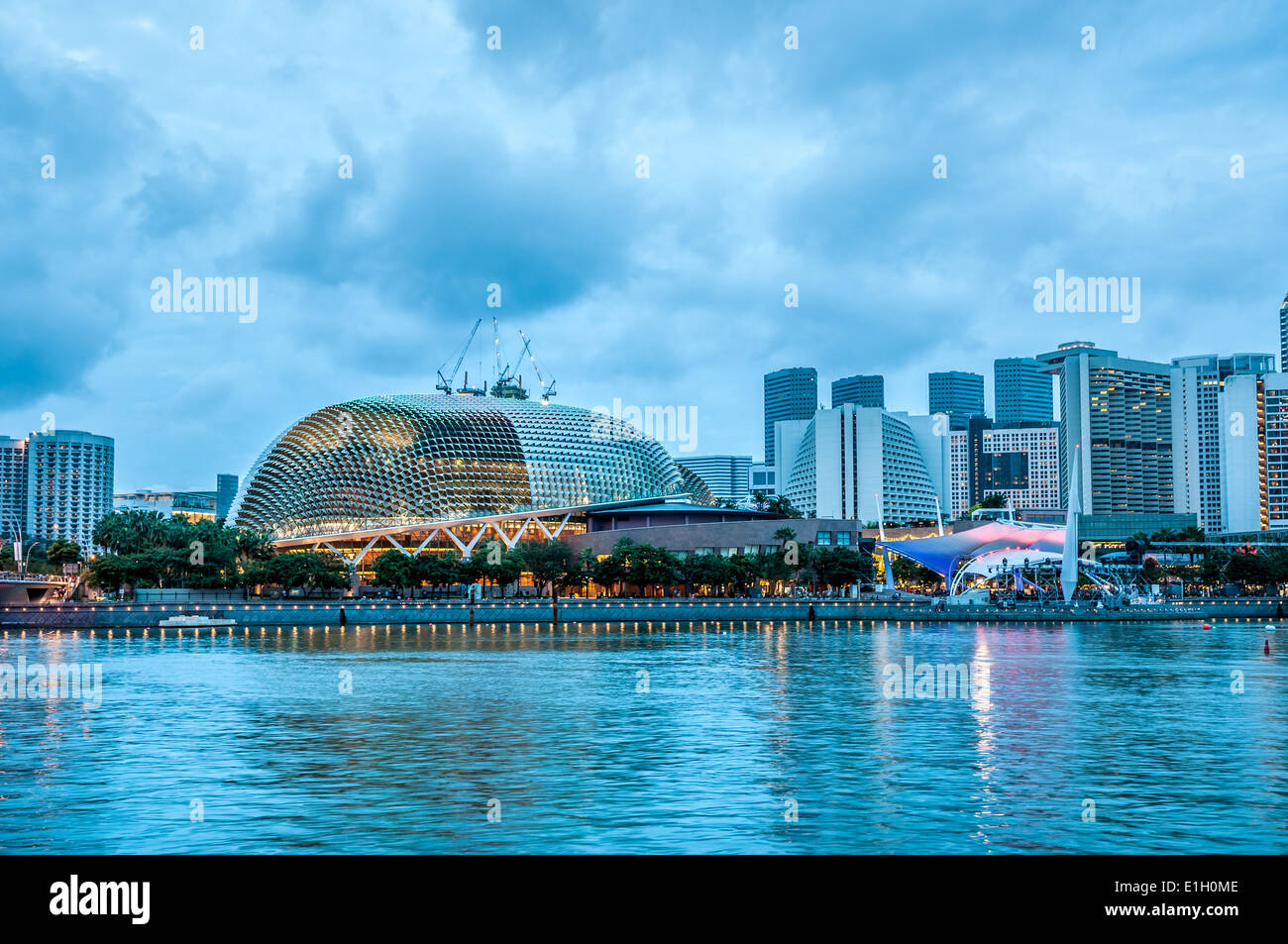 The skyline of Singapore at night, with the Esplanade lit up. Stock Photo