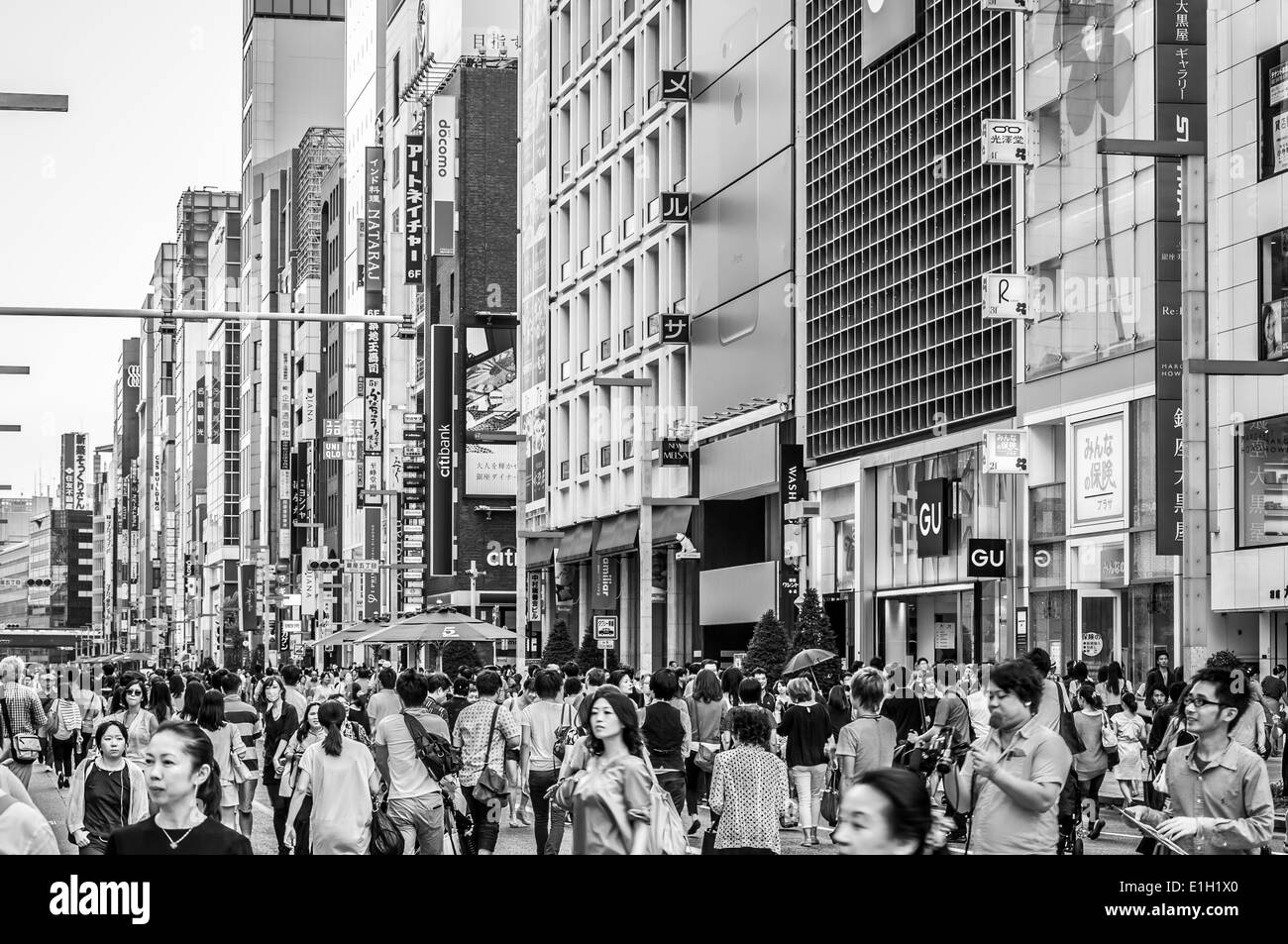 Shoppers wander the streets of Ginza in Tokyo, Japan. Stock Photo