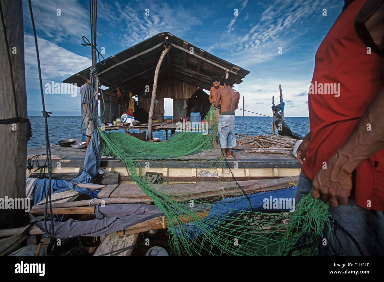 Miskito Indian fishermen preparing gill net, Puerto Cabezas, Nicaragua - Caribbean Sea. Stock Photo