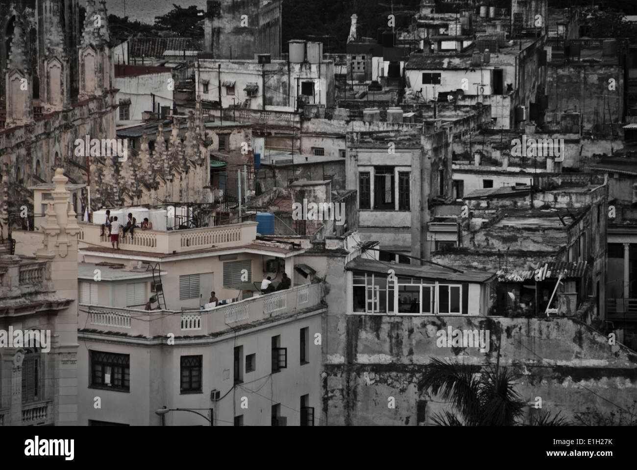 A group of people sitting on the rooftops of the houses in old Havana, Cuba Stock Photo