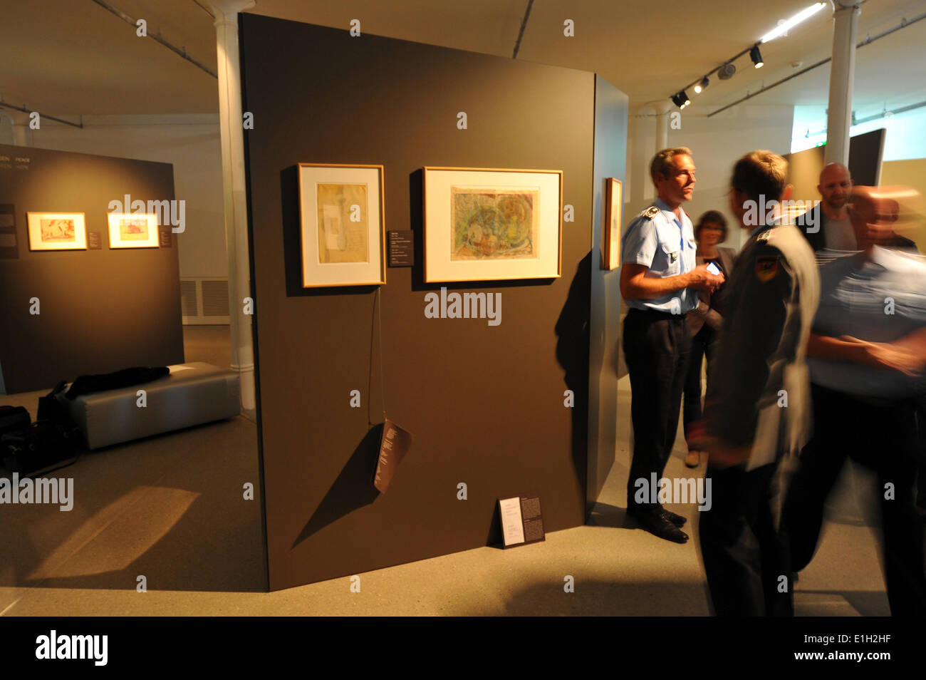 Dresden, Germany. 04th June, 2014. Visitors of the Bundeswehr Military History Museum look at exhibits of the special exhibition 'Krieg und Wahnsinn. Kunst aus der zivilen Psychiatrie zu Militär und I. Weltkrieg - Werke der Sammlung Prinzhorn' (lit. War and madness. Art from civil psychiatries on military and World War One - Works of the Prinzhorn collection' in Dresden, Germany, 04 June 2014. The special exhibtion which looks on the German Empire from an unusual point of view will be open until 07 September 2014. Photo: MATTHIAS HIEKEL/dpa/Alamy Live News Stock Photo