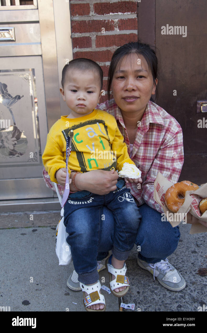 Chinese mom & young daughter watch the 2014 Memorial Day Parade, Bay
